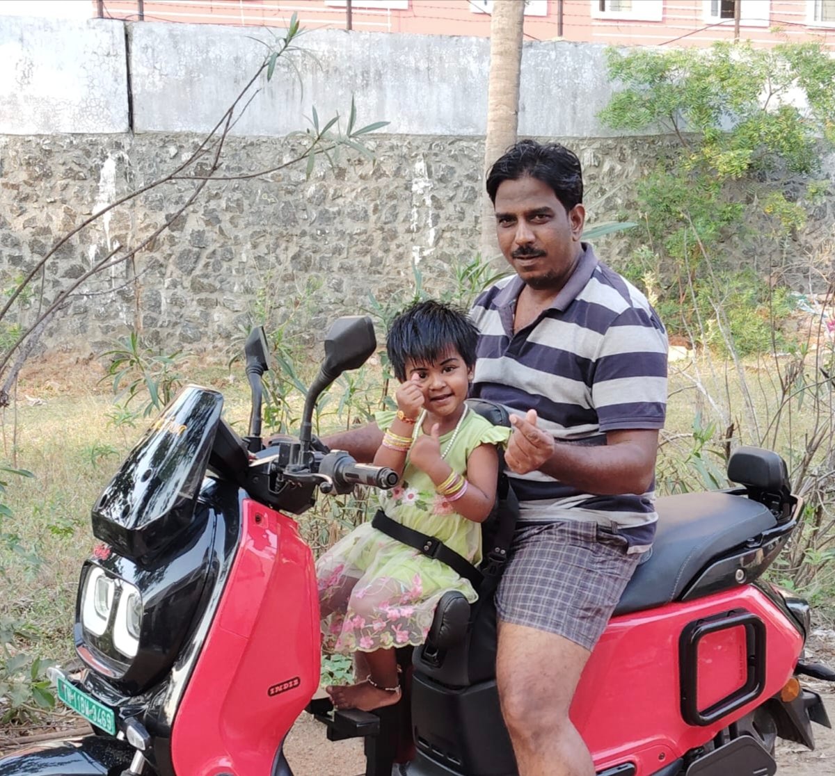 Father & Daughter on River Indie EV
